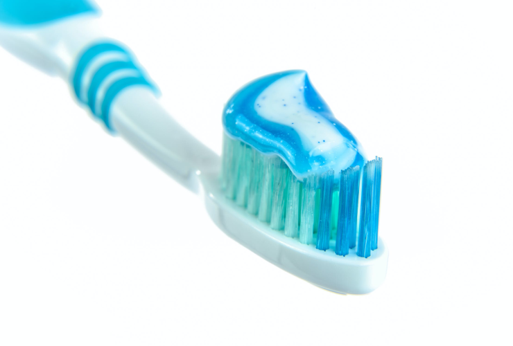 A Toothbrush with Toothpaste on its Bristles
